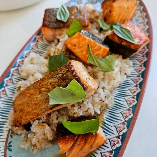 Seared salmon over rice with fresh basil