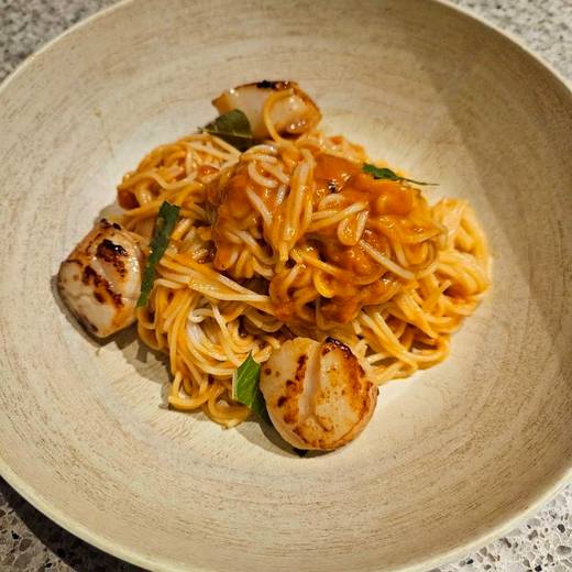 Seared scallops over pasta